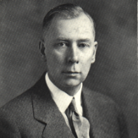 Headshot of Claude A. Burrett.