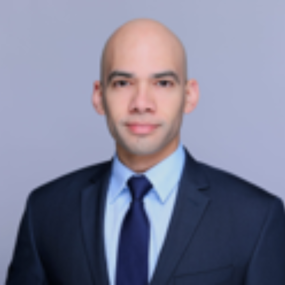 Bald man wearing blue suit