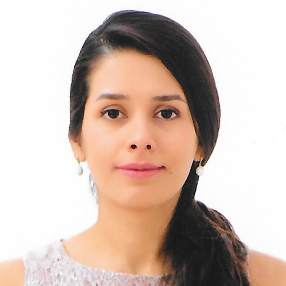 woman with long dark hair in ponytail in front of white background
