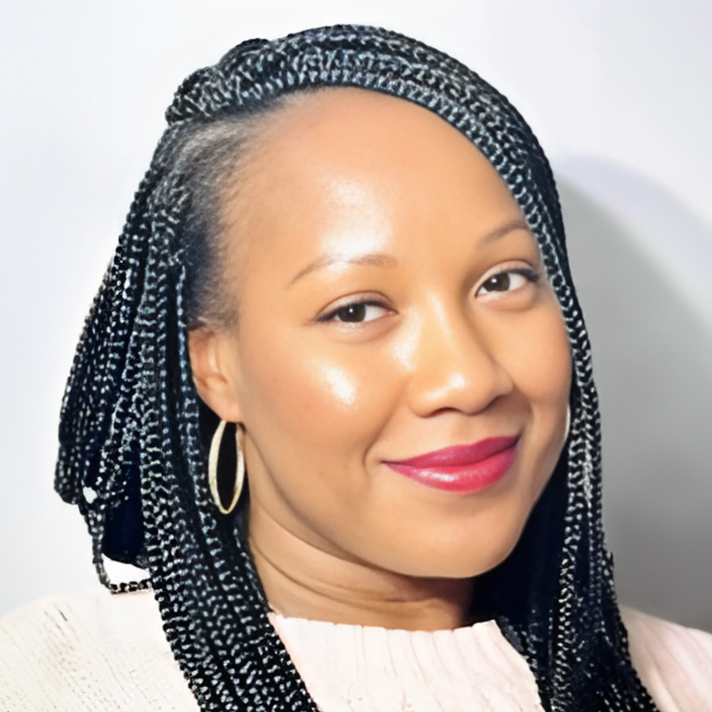 Black woman with long braided hair wearing white top