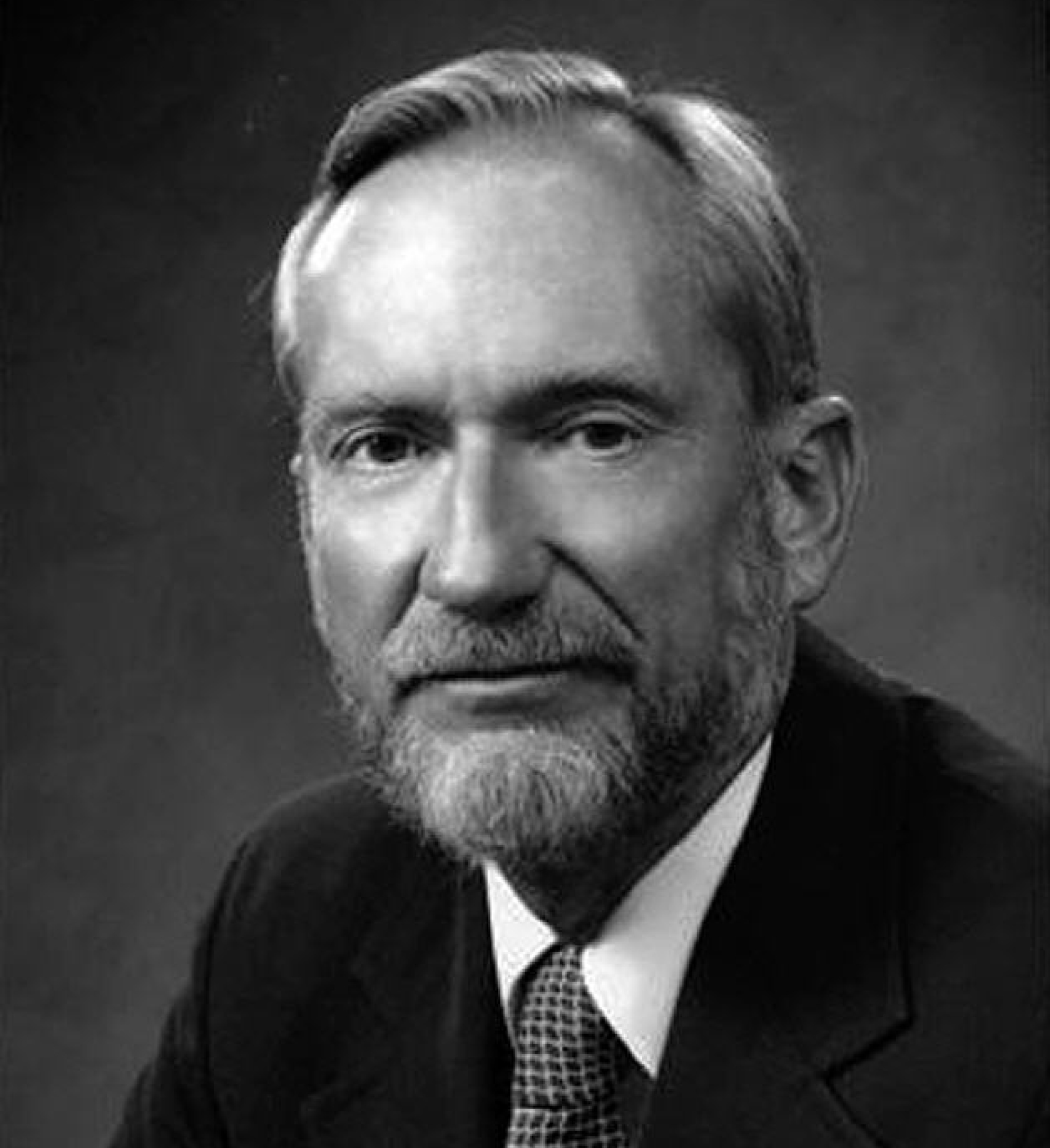 Edwin Kilbourne with light hair, a mustache and beard, and a suit