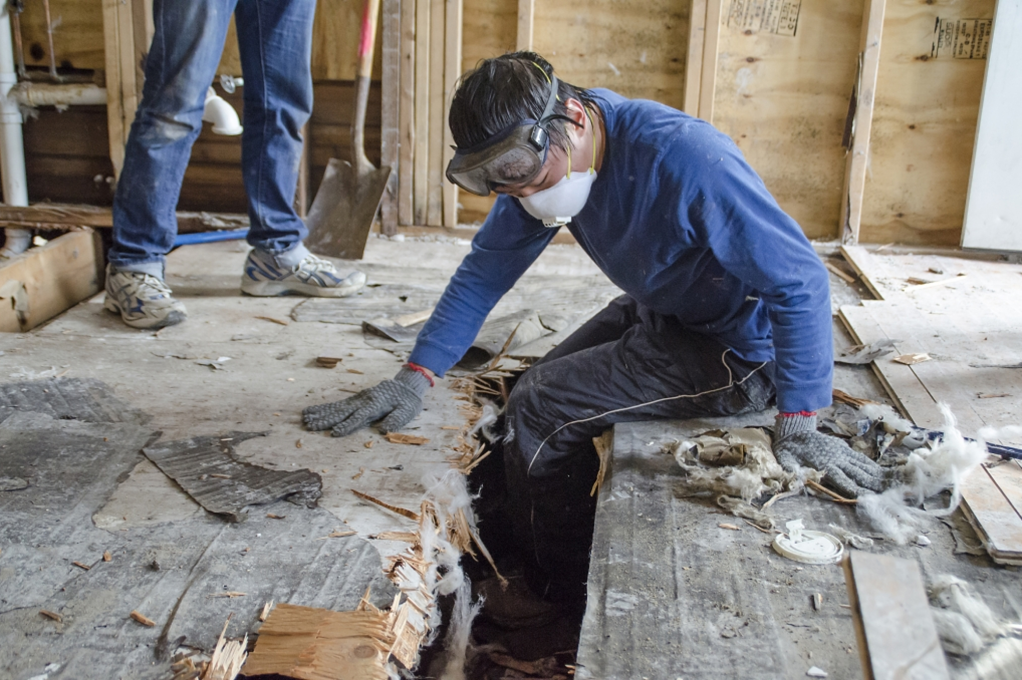 Worker in destroyed house after the hurricane