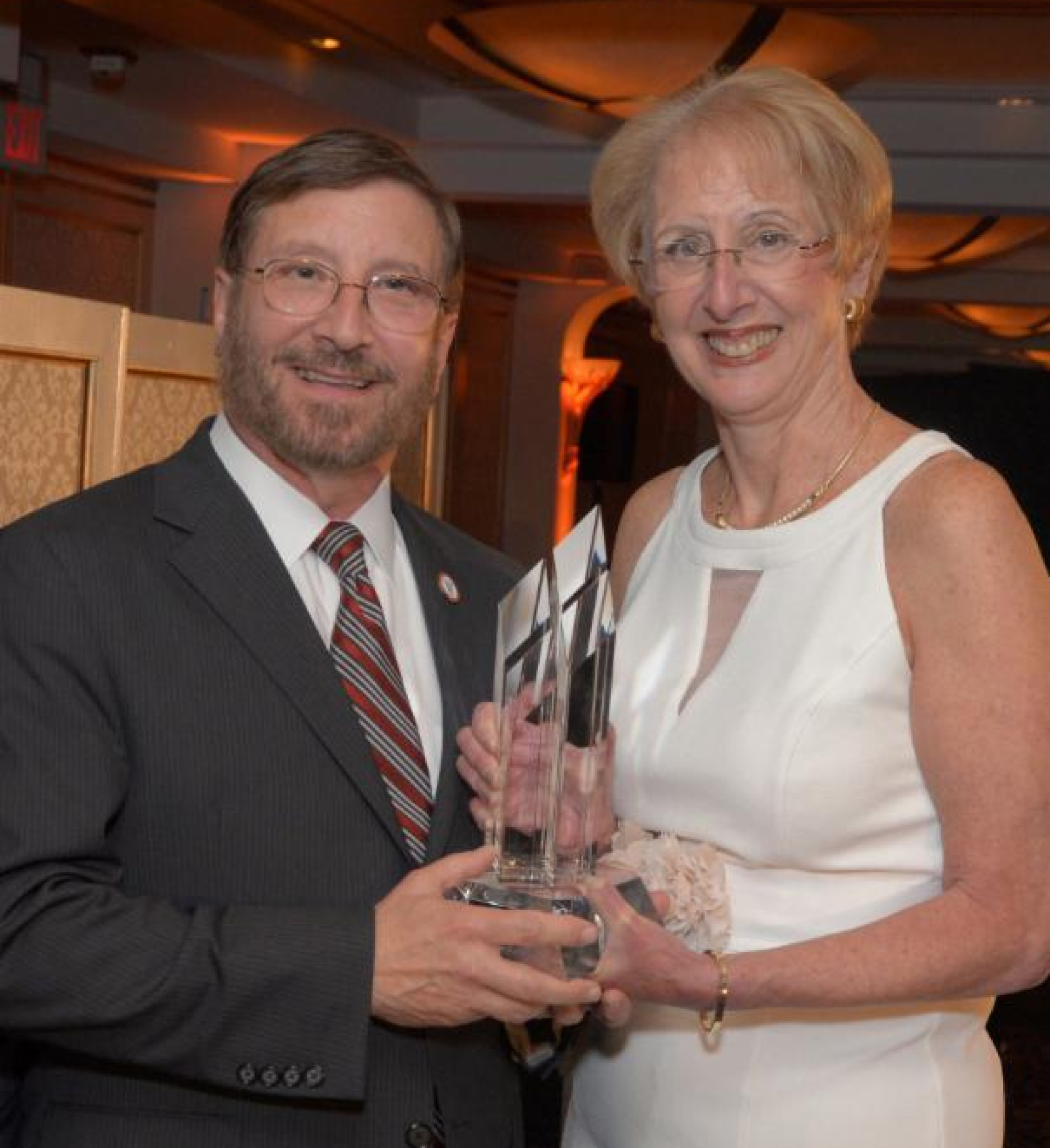 Robert W. Amler, M.D., M.B.A., dean of the School of Health Sciences and Practice and vice president for government affairs, proudly accepting the award on behalf of NYMC from Marsha Gordon, M.B.A., D.B.A., president and chief executive officer of the Business Council of Westchester.