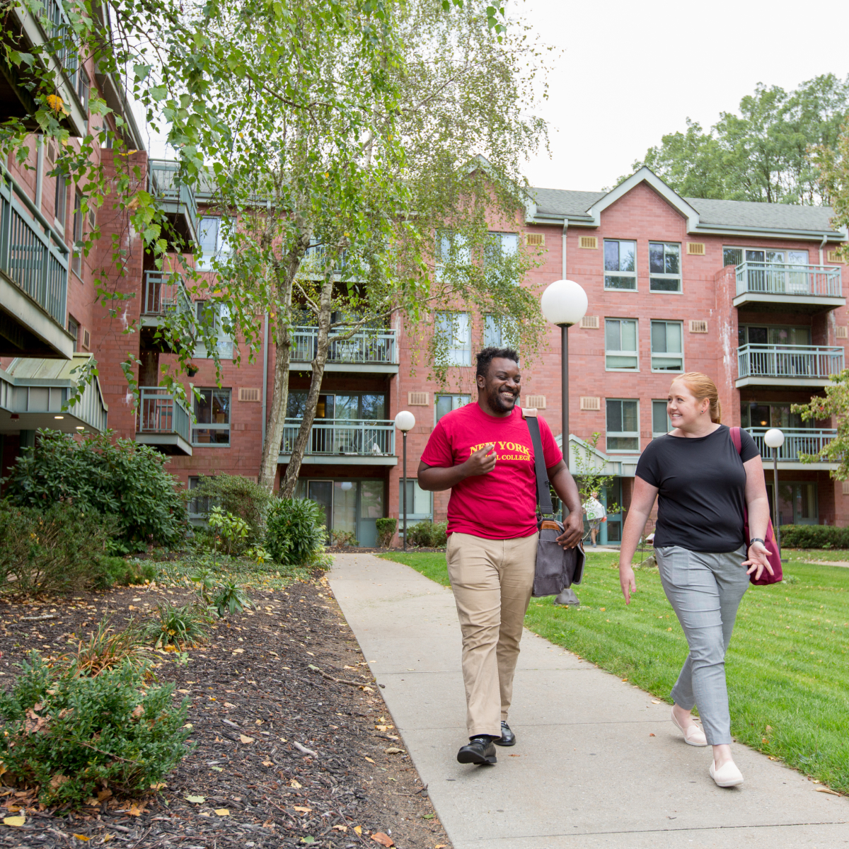 students walking outside student housing