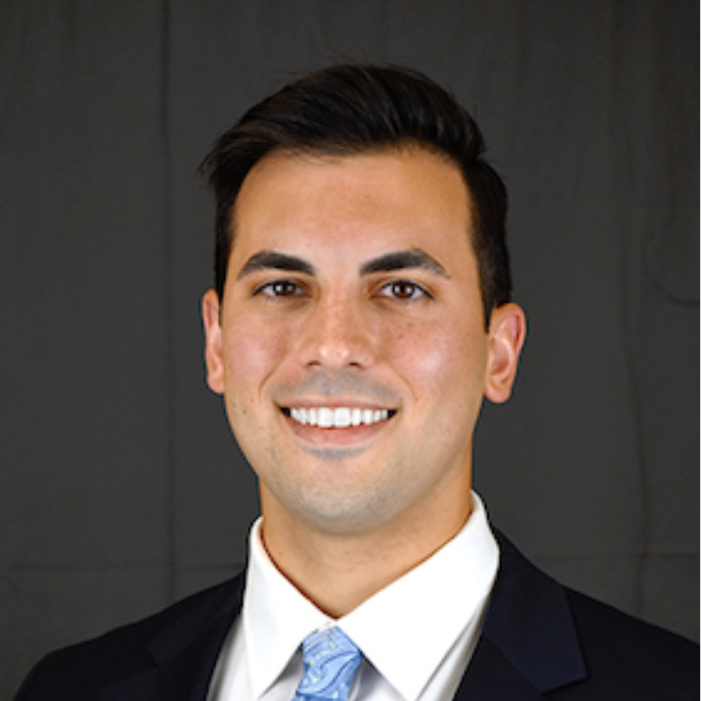 Headshot of Austin J. Jabbour smiling.