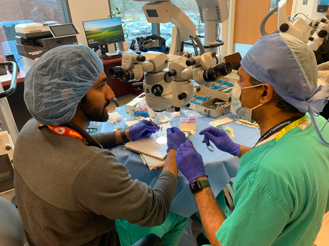 Two residents developing surgical skills in wet labs